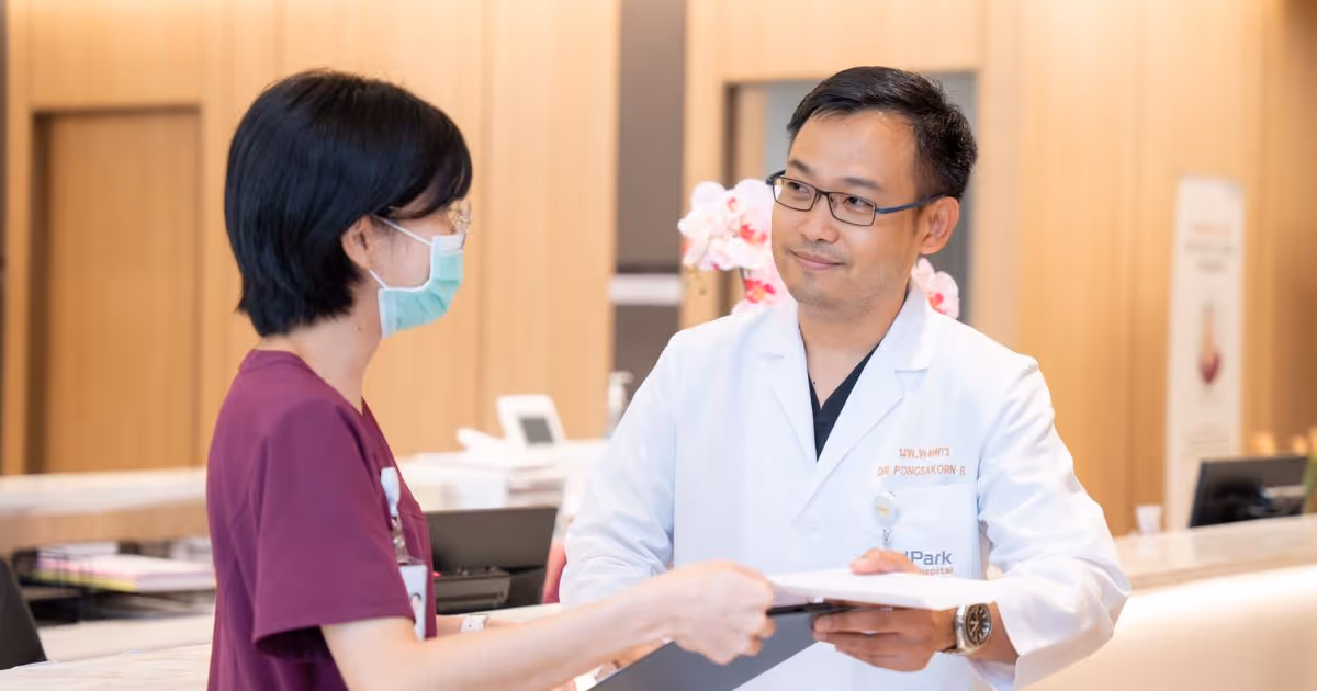 Dr Pongsakorn Bupparenoo With a Nurse at Orthopedic Center